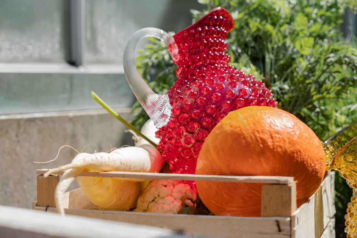 Underlay Garnet Hobnail Jug in a basket with vegetables